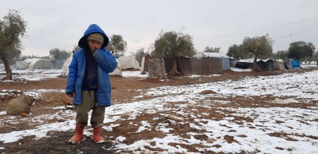 A camp for internally displaced people in northwest Syria offers a bleak and cold existence for Samer*, 5. Aid workers are working around the clock to provide emergency support, but with tens of thousands of people arriving every day, supplies are low and the humanitarian response is overwhelmed. *Name changed to protect identity.