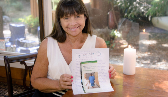 Sponsor holding picture of child.